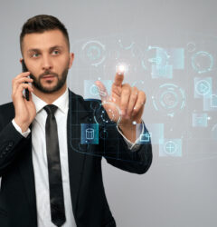 Young businessman clicking virtual button.